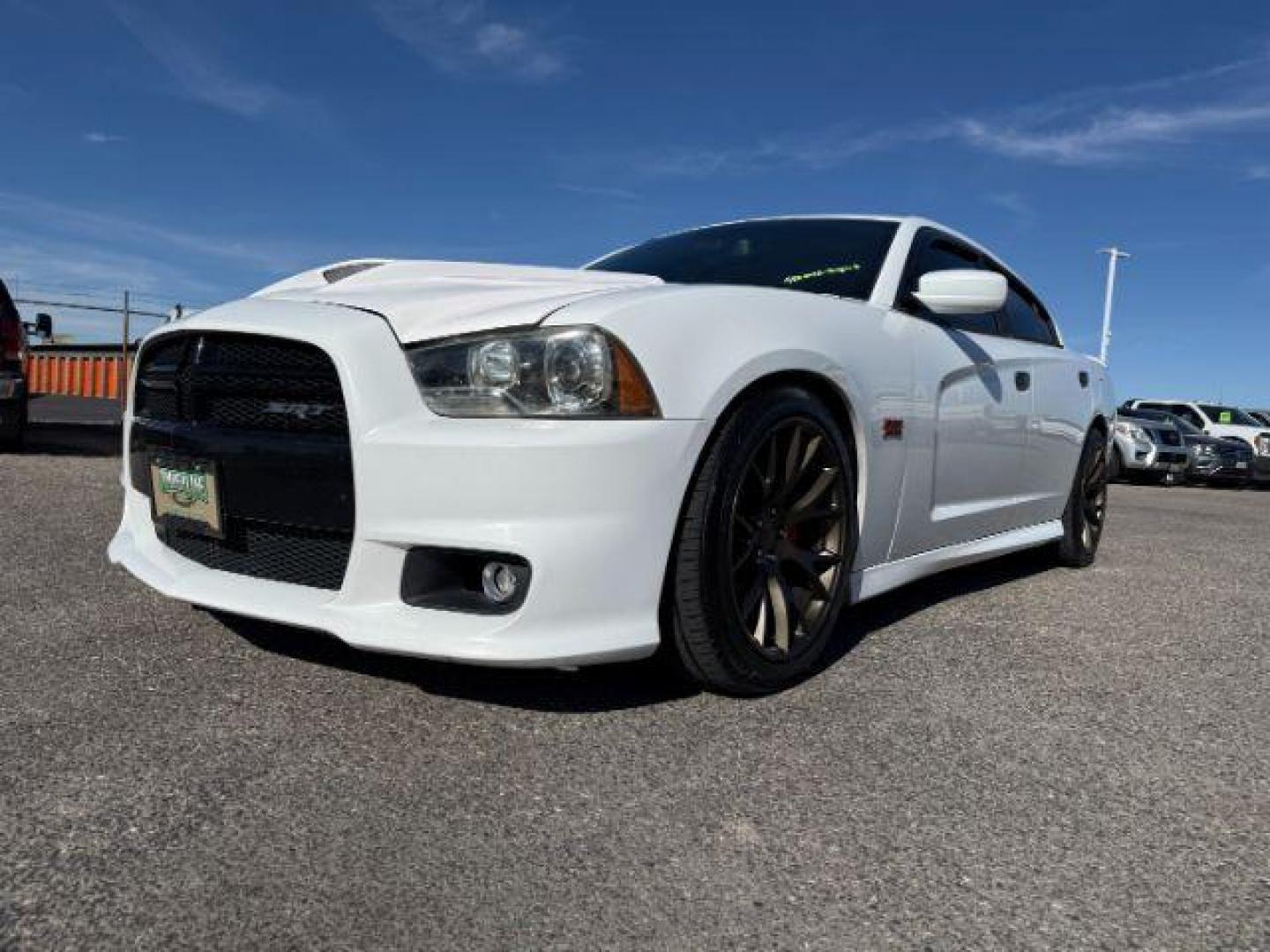 2012 Bright White Clearcoat /Black Dodge Charger (2C3CDXEJ9CH) with an HEMI 64L V-8 premium unleaded engine, Automatic transmission, located at 1175 N Woodruff Ave, Idaho Falls, ID, 83401, 43.506901, -111.999657 - At Timberline Auto, finding a great deal on your next vehicle is always easy! Our experienced sales staff's goal is to help find you the right vehicle at the right price! Our knowledgeable finance department has options for almost any credit score. We offer extended service contract options to prote - Photo#0