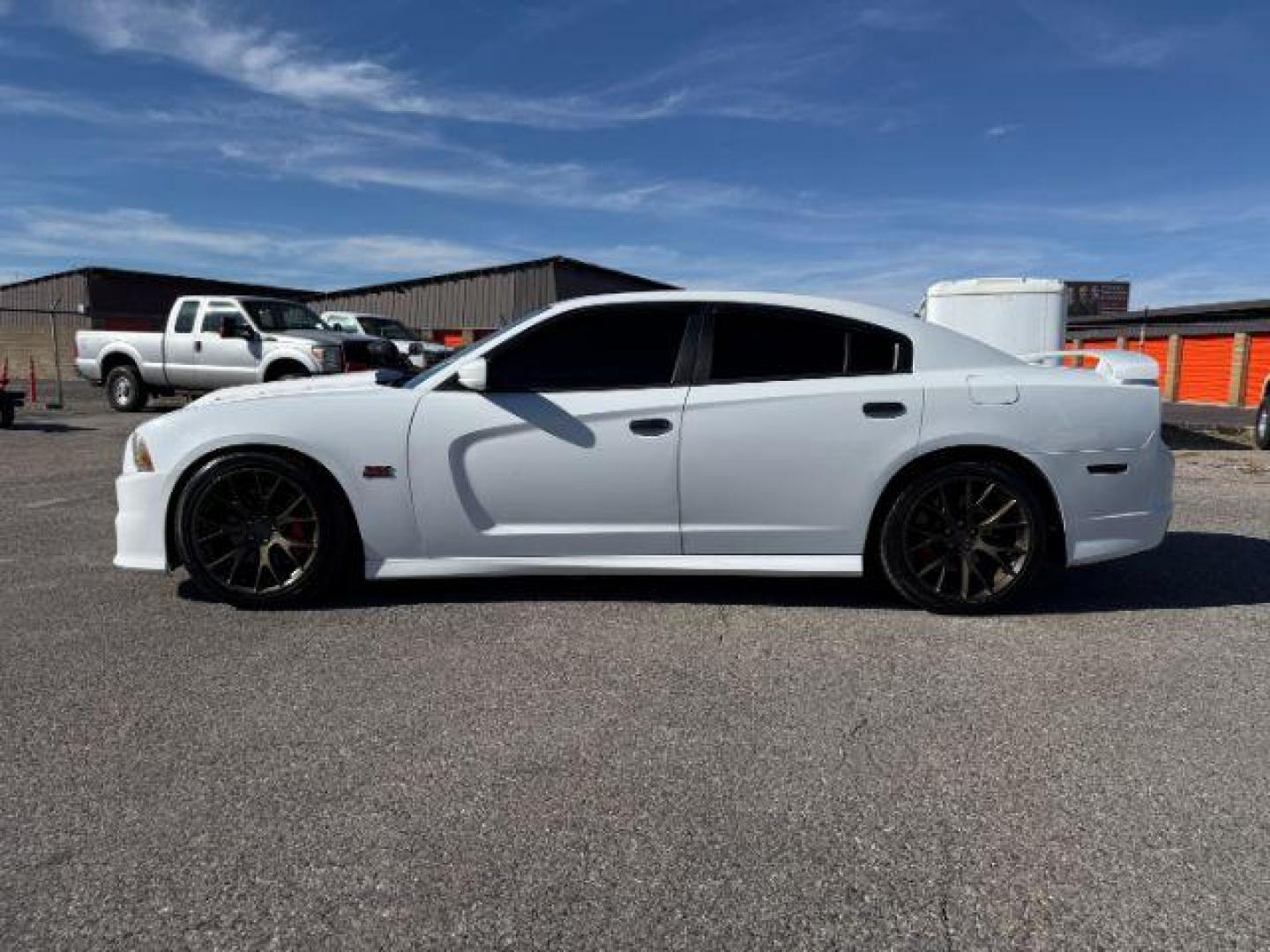 2012 Bright White Clearcoat /Black Dodge Charger (2C3CDXEJ9CH) with an HEMI 64L V-8 premium unleaded engine, Automatic transmission, located at 1175 N Woodruff Ave, Idaho Falls, ID, 83401, 43.506901, -111.999657 - At Timberline Auto, finding a great deal on your next vehicle is always easy! Our experienced sales staff's goal is to help find you the right vehicle at the right price! Our knowledgeable finance department has options for almost any credit score. We offer extended service contract options to prote - Photo#1