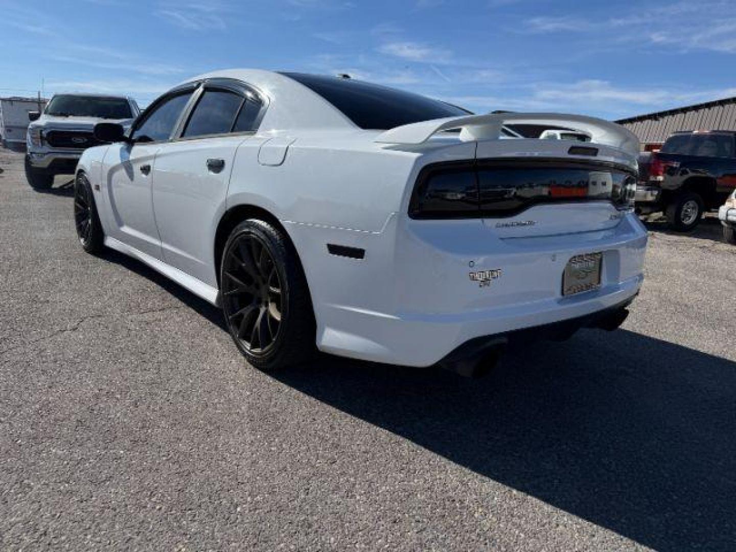 2012 Bright White Clearcoat /Black Dodge Charger (2C3CDXEJ9CH) with an HEMI 64L V-8 premium unleaded engine, Automatic transmission, located at 1175 N Woodruff Ave, Idaho Falls, ID, 83401, 43.506901, -111.999657 - At Timberline Auto, finding a great deal on your next vehicle is always easy! Our experienced sales staff's goal is to help find you the right vehicle at the right price! Our knowledgeable finance department has options for almost any credit score. We offer extended service contract options to prote - Photo#2