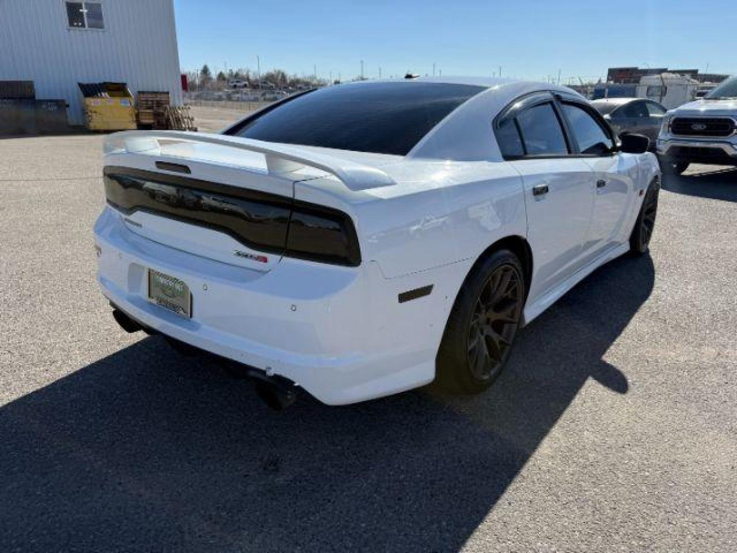 2012 Bright White Clearcoat /Black Dodge Charger (2C3CDXEJ9CH) with an HEMI 64L V-8 premium unleaded engine, Automatic transmission, located at 1175 N Woodruff Ave, Idaho Falls, ID, 83401, 43.506901, -111.999657 - At Timberline Auto, finding a great deal on your next vehicle is always easy! Our experienced sales staff's goal is to help find you the right vehicle at the right price! Our knowledgeable finance department has options for almost any credit score. We offer extended service contract options to prote - Photo#5