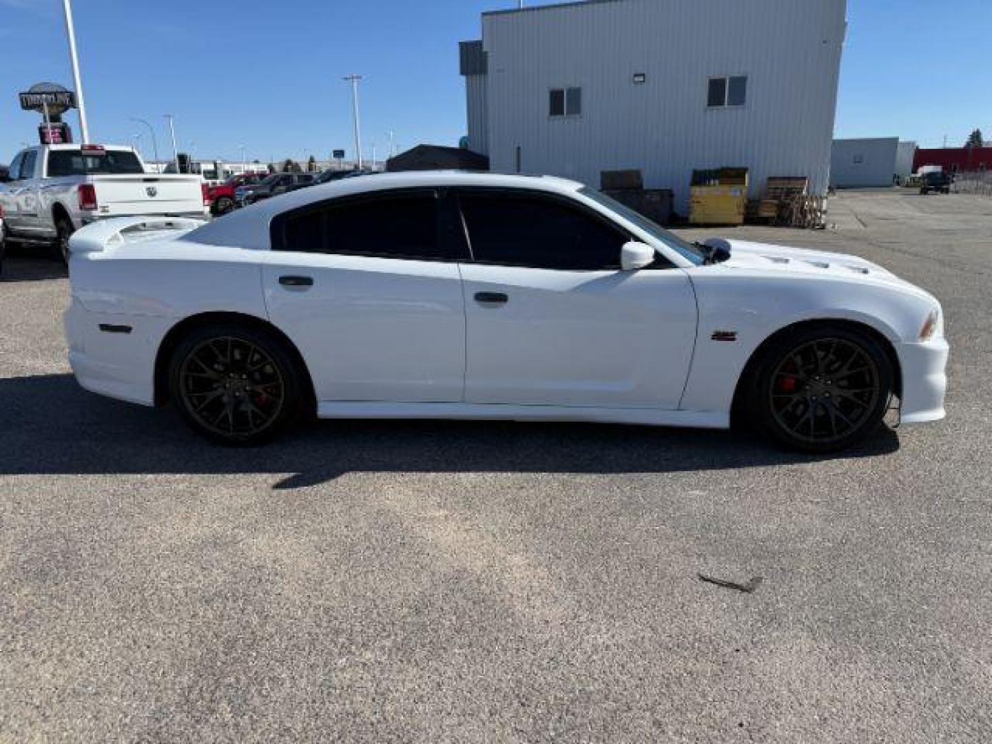 2012 Bright White Clearcoat /Black Dodge Charger (2C3CDXEJ9CH) with an HEMI 64L V-8 premium unleaded engine, Automatic transmission, located at 1175 N Woodruff Ave, Idaho Falls, ID, 83401, 43.506901, -111.999657 - At Timberline Auto, finding a great deal on your next vehicle is always easy! Our experienced sales staff's goal is to help find you the right vehicle at the right price! Our knowledgeable finance department has options for almost any credit score. We offer extended service contract options to prote - Photo#6