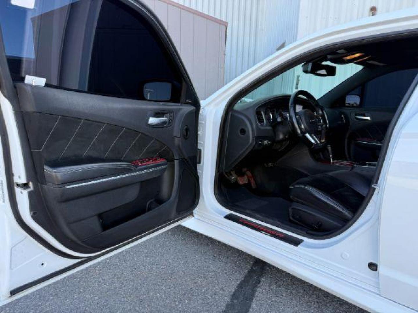 2012 Bright White Clearcoat /Black Dodge Charger (2C3CDXEJ9CH) with an HEMI 64L V-8 premium unleaded engine, Automatic transmission, located at 1175 N Woodruff Ave, Idaho Falls, ID, 83401, 43.506901, -111.999657 - At Timberline Auto, finding a great deal on your next vehicle is always easy! Our experienced sales staff's goal is to help find you the right vehicle at the right price! Our knowledgeable finance department has options for almost any credit score. We offer extended service contract options to prote - Photo#11