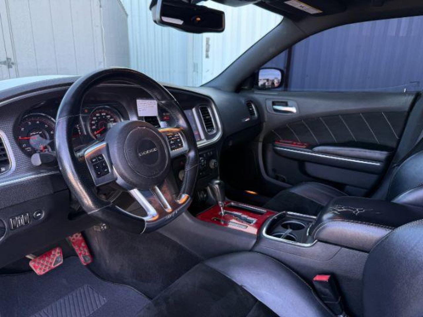 2012 Bright White Clearcoat /Black Dodge Charger (2C3CDXEJ9CH) with an HEMI 64L V-8 premium unleaded engine, Automatic transmission, located at 1175 N Woodruff Ave, Idaho Falls, ID, 83401, 43.506901, -111.999657 - At Timberline Auto, finding a great deal on your next vehicle is always easy! Our experienced sales staff's goal is to help find you the right vehicle at the right price! Our knowledgeable finance department has options for almost any credit score. We offer extended service contract options to prote - Photo#13