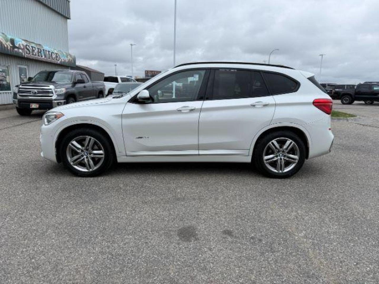 2016 WHITE /Black BMW X1 (WBXHT3C37G5) with an 2L I-4 gasoline direct injection engine, Automatic transmission, located at 1175 N Woodruff Ave, Idaho Falls, ID, 83401, 43.506901, -111.999657 - Photo#30