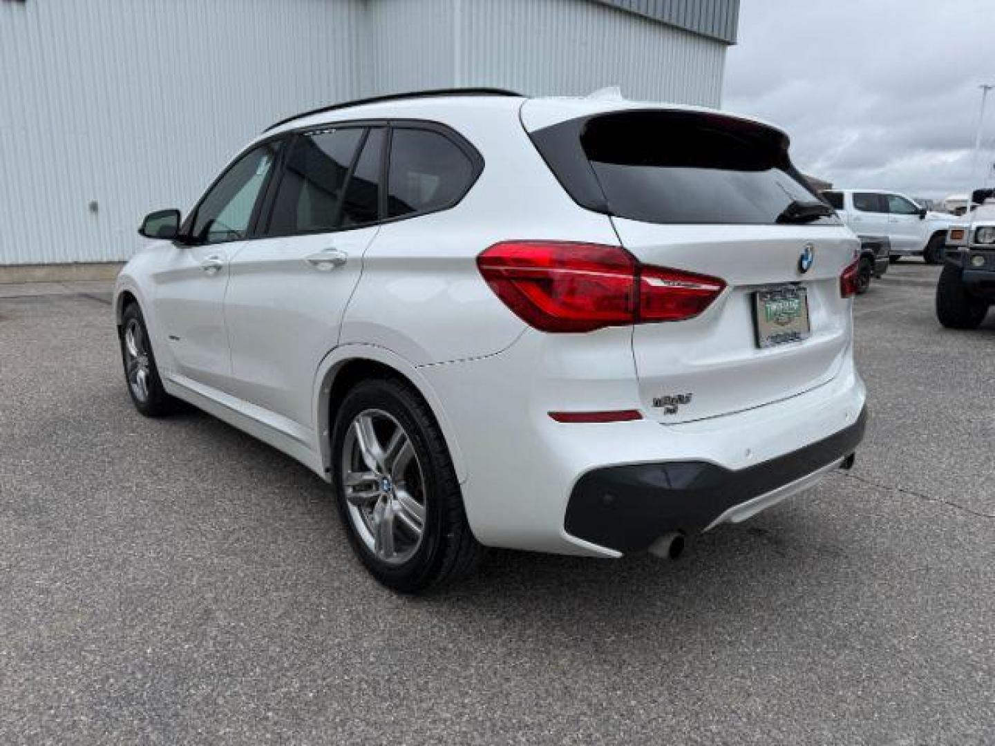 2016 WHITE /Black BMW X1 (WBXHT3C37G5) with an 2L I-4 gasoline direct injection engine, Automatic transmission, located at 1175 N Woodruff Ave, Idaho Falls, ID, 83401, 43.506901, -111.999657 - Photo#31