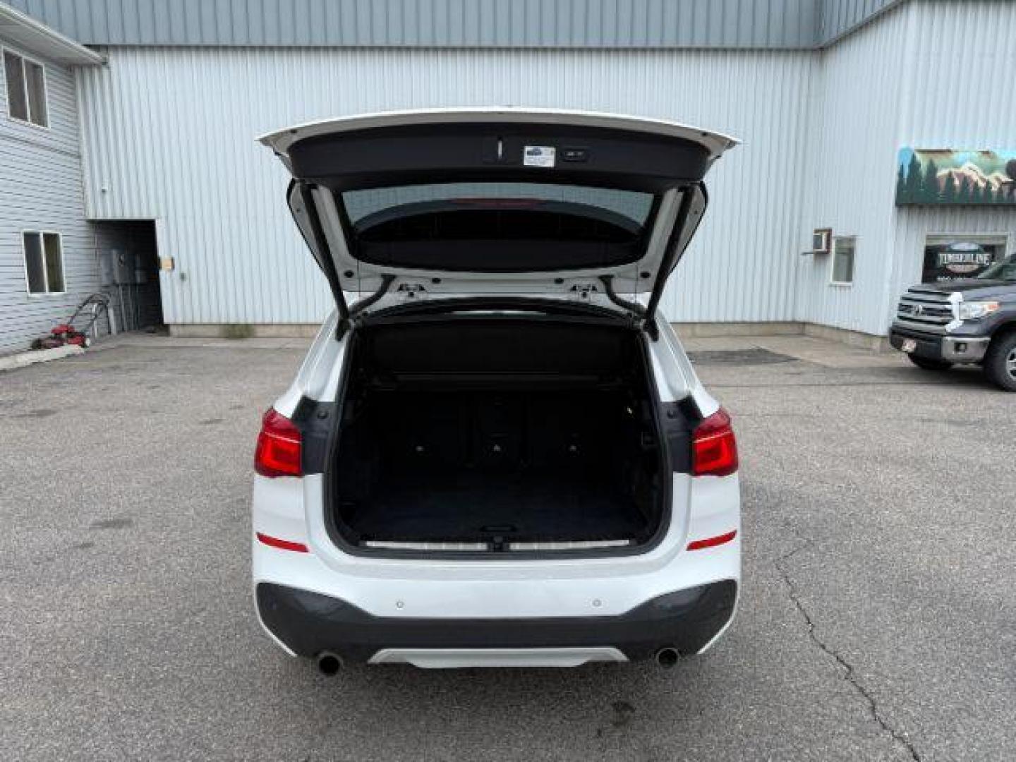 2016 WHITE /Black BMW X1 (WBXHT3C37G5) with an 2L I-4 gasoline direct injection engine, Automatic transmission, located at 1175 N Woodruff Ave, Idaho Falls, ID, 83401, 43.506901, -111.999657 - Photo#34