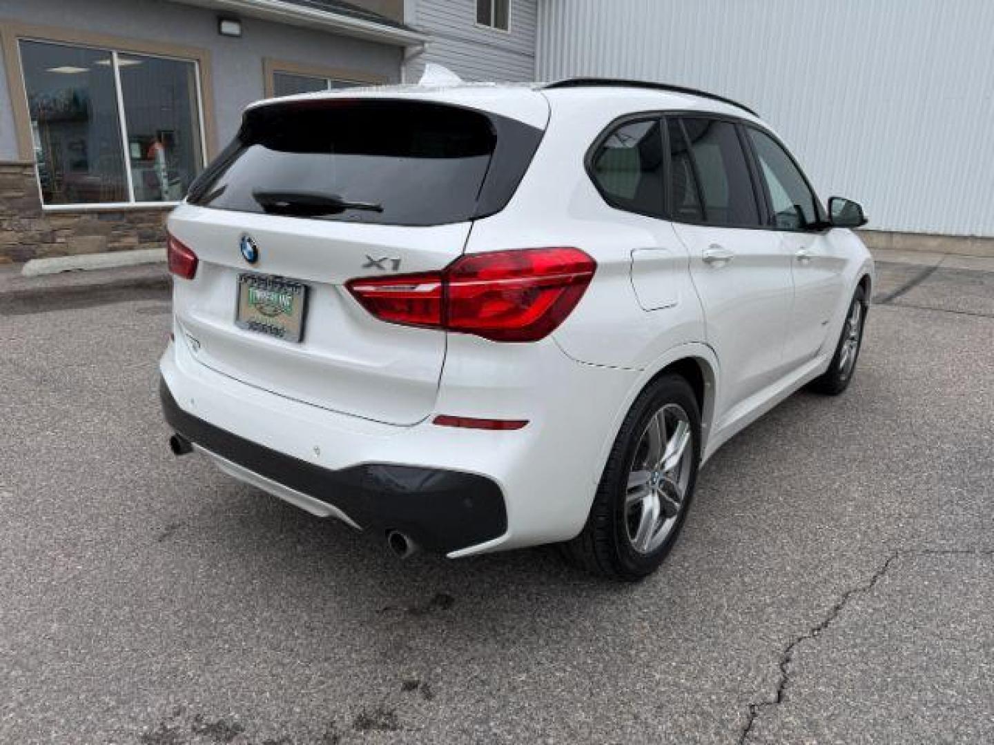 2016 WHITE /Black BMW X1 (WBXHT3C37G5) with an 2L I-4 gasoline direct injection engine, Automatic transmission, located at 1175 N Woodruff Ave, Idaho Falls, ID, 83401, 43.506901, -111.999657 - Photo#38
