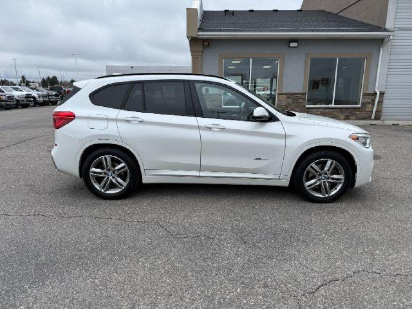 2016 WHITE /Black BMW X1 (WBXHT3C37G5) with an 2L I-4 gasoline direct injection engine, Automatic transmission, located at 1175 N Woodruff Ave, Idaho Falls, ID, 83401, 43.506901, -111.999657 - Photo#39