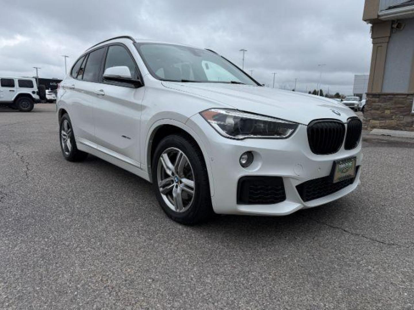 2016 WHITE /Black BMW X1 (WBXHT3C37G5) with an 2L I-4 gasoline direct injection engine, Automatic transmission, located at 1175 N Woodruff Ave, Idaho Falls, ID, 83401, 43.506901, -111.999657 - Photo#40