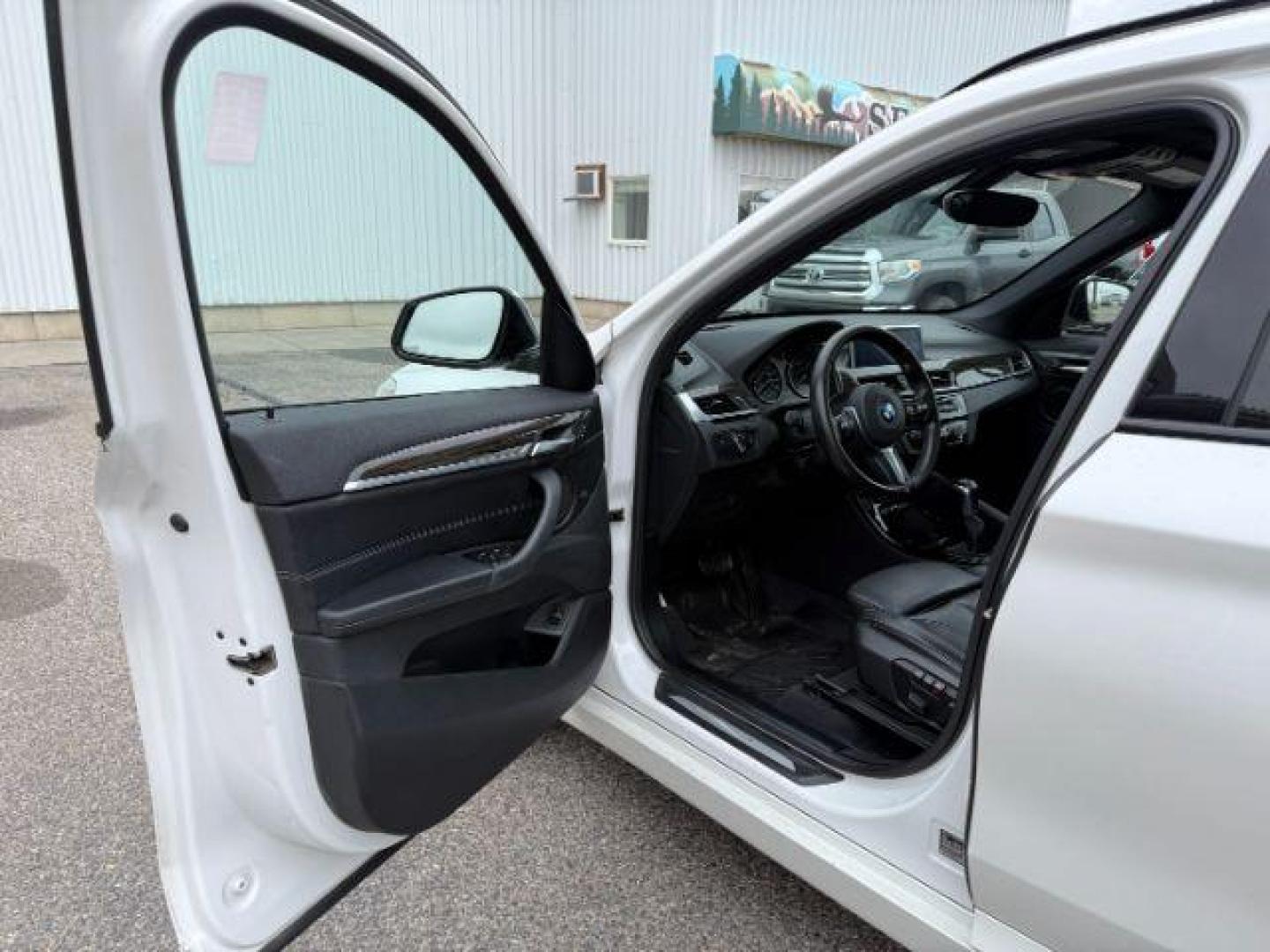2016 WHITE /Black BMW X1 (WBXHT3C37G5) with an 2L I-4 gasoline direct injection engine, Automatic transmission, located at 1175 N Woodruff Ave, Idaho Falls, ID, 83401, 43.506901, -111.999657 - Photo#44