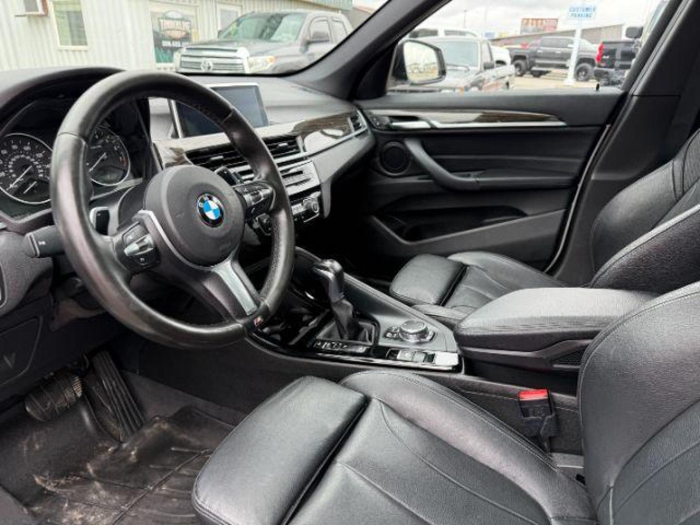 2016 WHITE /Black BMW X1 (WBXHT3C37G5) with an 2L I-4 gasoline direct injection engine, Automatic transmission, located at 1175 N Woodruff Ave, Idaho Falls, ID, 83401, 43.506901, -111.999657 - Photo#46