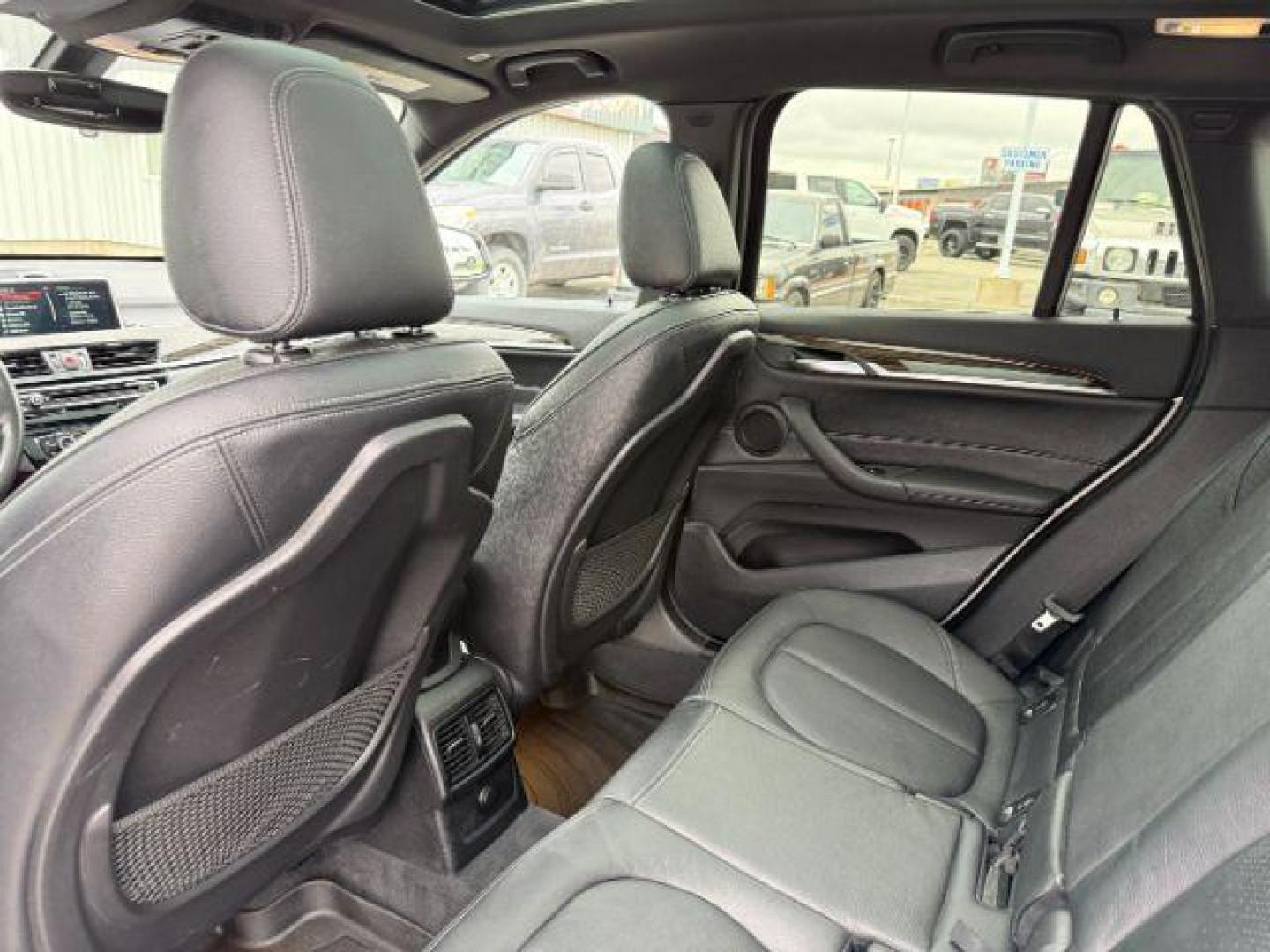 2016 WHITE /Black BMW X1 (WBXHT3C37G5) with an 2L I-4 gasoline direct injection engine, Automatic transmission, located at 1175 N Woodruff Ave, Idaho Falls, ID, 83401, 43.506901, -111.999657 - Photo#56