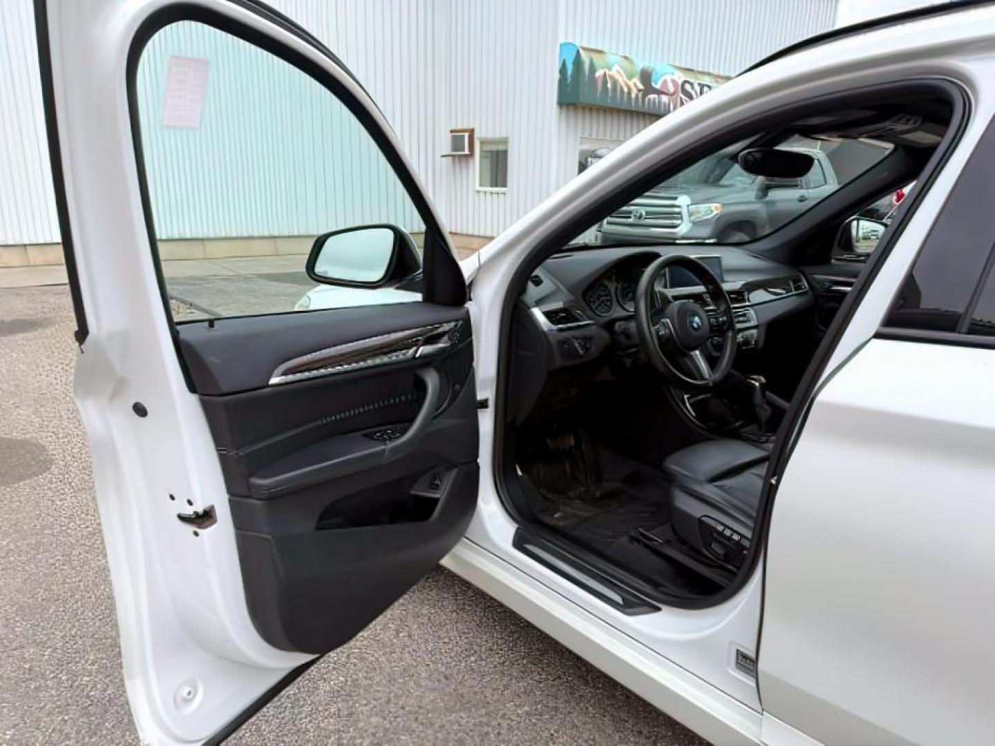 2016 WHITE /Black BMW X1 (WBXHT3C37G5) with an 2L I-4 gasoline direct injection engine, Automatic transmission, located at 1175 N Woodruff Ave, Idaho Falls, ID, 83401, 43.506901, -111.999657 - Photo#15