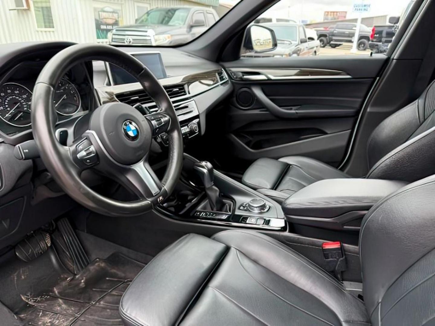 2016 WHITE /Black BMW X1 (WBXHT3C37G5) with an 2L I-4 gasoline direct injection engine, Automatic transmission, located at 1175 N Woodruff Ave, Idaho Falls, ID, 83401, 43.506901, -111.999657 - Photo#17