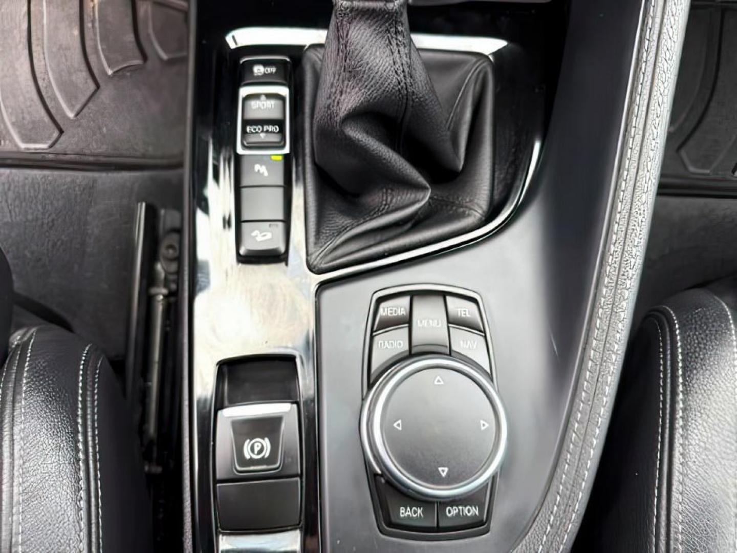 2016 WHITE /Black BMW X1 (WBXHT3C37G5) with an 2L I-4 gasoline direct injection engine, Automatic transmission, located at 1175 N Woodruff Ave, Idaho Falls, ID, 83401, 43.506901, -111.999657 - Photo#22