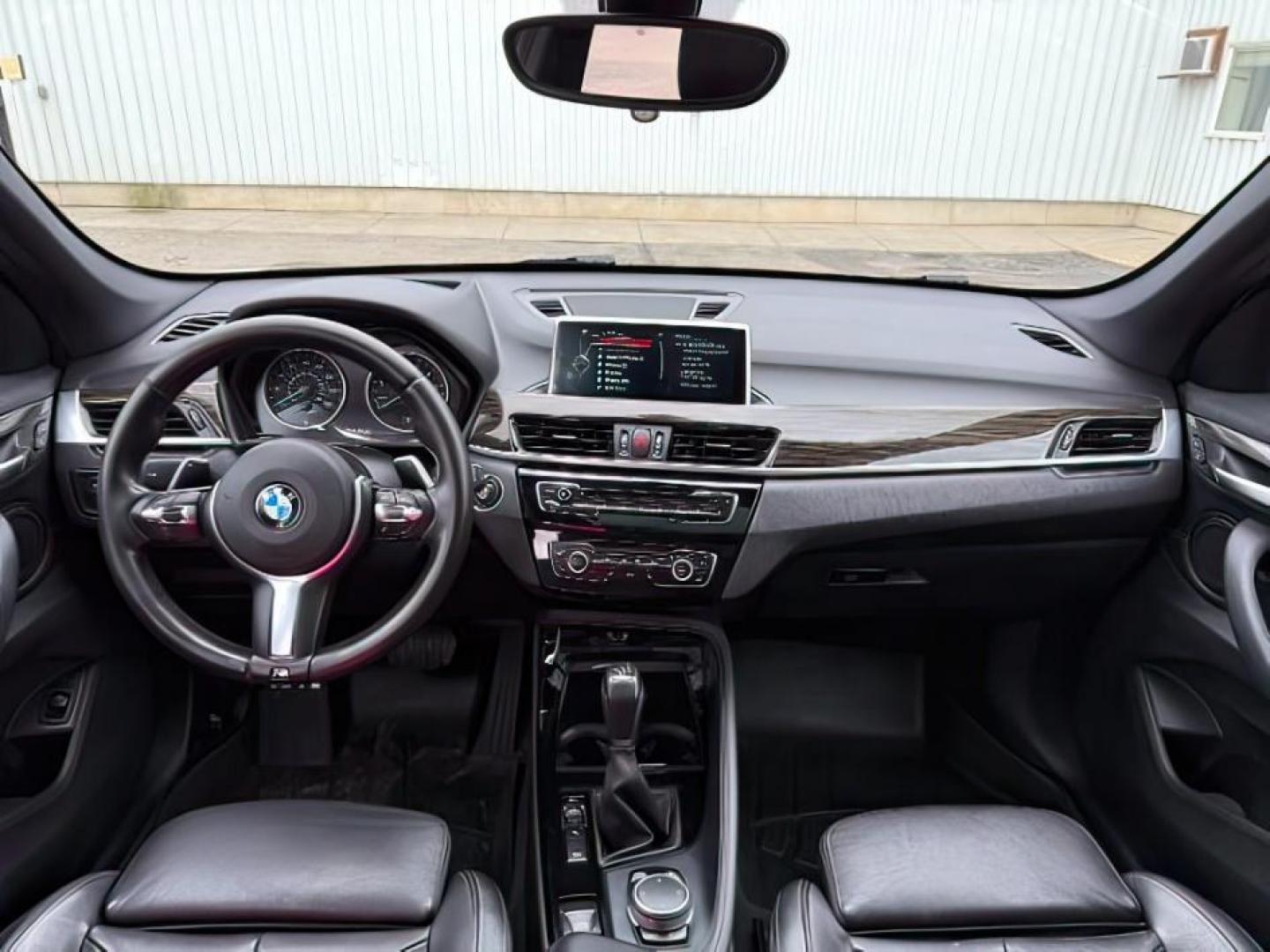 2016 WHITE /Black BMW X1 (WBXHT3C37G5) with an 2L I-4 gasoline direct injection engine, Automatic transmission, located at 1175 N Woodruff Ave, Idaho Falls, ID, 83401, 43.506901, -111.999657 - Photo#26