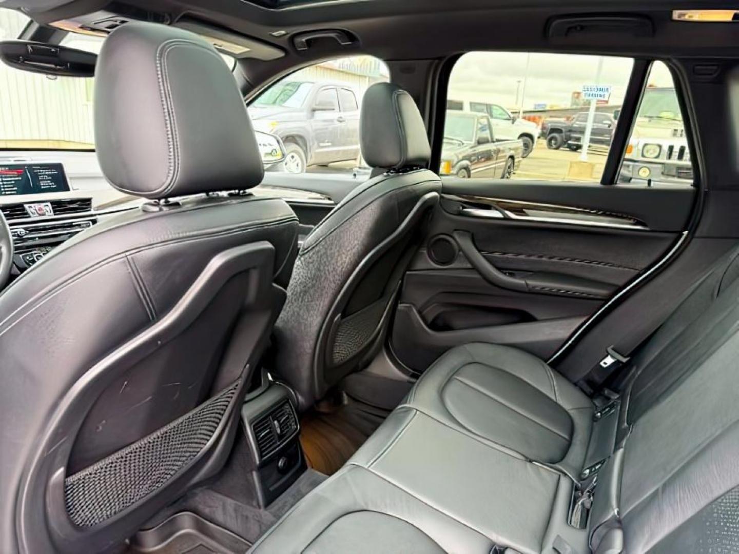 2016 WHITE /Black BMW X1 (WBXHT3C37G5) with an 2L I-4 gasoline direct injection engine, Automatic transmission, located at 1175 N Woodruff Ave, Idaho Falls, ID, 83401, 43.506901, -111.999657 - Photo#27