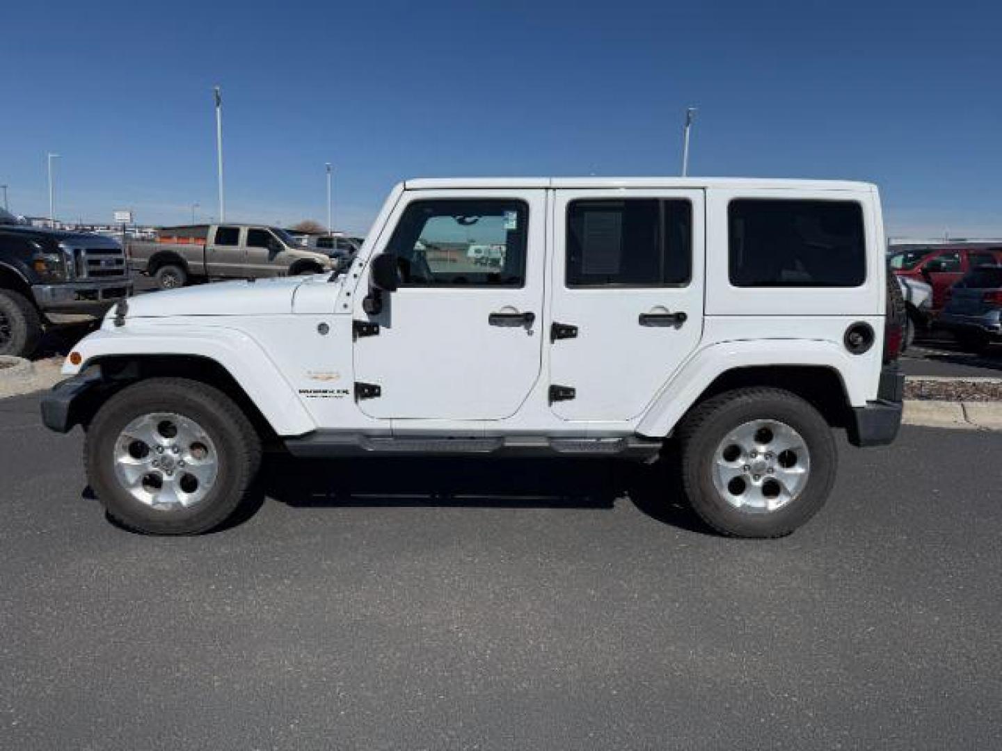 2015 Bright White /Black Jeep Wrangler Unlimited (1C4BJWEG9FL) with an Pentastar 36L V-6 DOHC engine, Automatic transmission, located at 1175 N Woodruff Ave, Idaho Falls, ID, 83401, 43.506901, -111.999657 - At Timberline Auto, finding a great deal on your next vehicle is always easy! Our experienced sales staff's goal is to help find you the right vehicle at the right price! Our knowledgeable finance department has options for almost any credit score. We offer extended service contract options to prote - Photo#1
