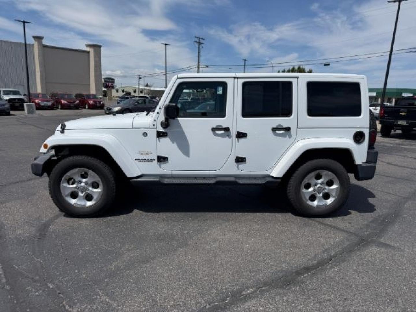 2015 Bright White /Black Jeep Wrangler Unlimited Sahara (1C4BJWEG9FL) with an Pentastar 3.6L V-6 DOHC engine, AUTOMATIC transmission, located at 1235 N Woodruff Ave., Idaho Falls, 83401, (208) 523-1053, 43.507172, -112.000488 - At Timberline Auto, finding a great deal on your next vehicle is always easy! Our experienced sales staff's goal is to help find you the right vehicle at the right price! Our knowledgeable finance department has options for almost any credit score. We offer extended service contract options to prote - Photo#26