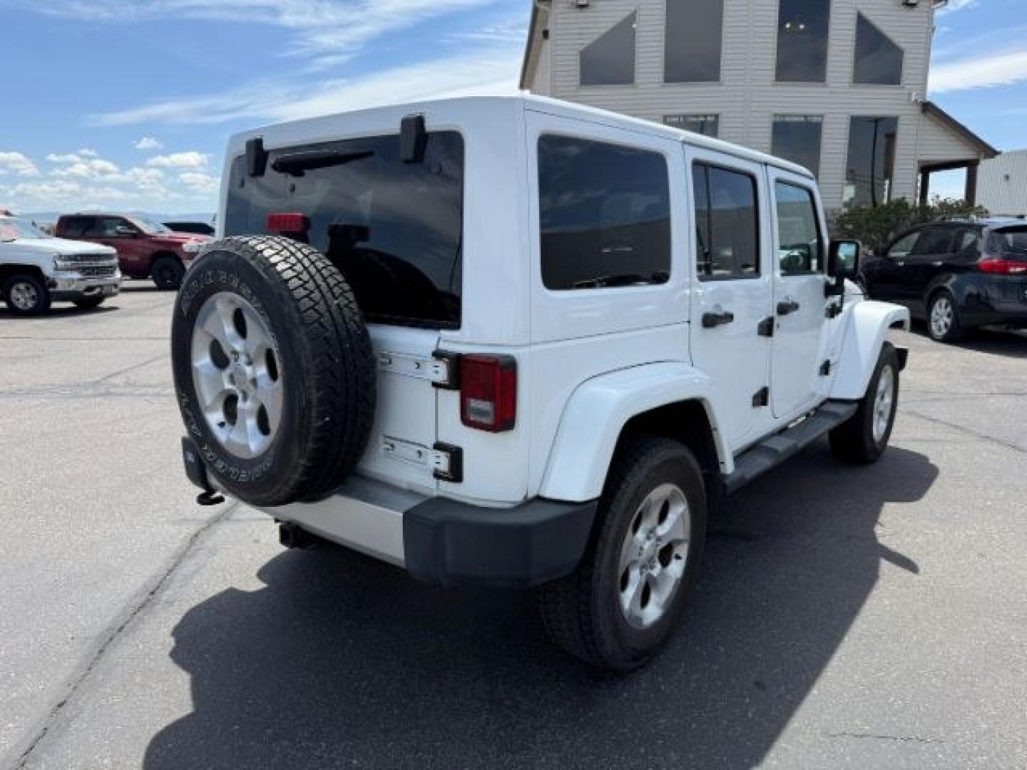 2015 Bright White /Black Jeep Wrangler Unlimited Sahara (1C4BJWEG9FL) with an Pentastar 3.6L V-6 DOHC engine, AUTOMATIC transmission, located at 1235 N Woodruff Ave., Idaho Falls, 83401, (208) 523-1053, 43.507172, -112.000488 - At Timberline Auto, finding a great deal on your next vehicle is always easy! Our experienced sales staff's goal is to help find you the right vehicle at the right price! Our knowledgeable finance department has options for almost any credit score. We offer extended service contract options to prote - Photo#31