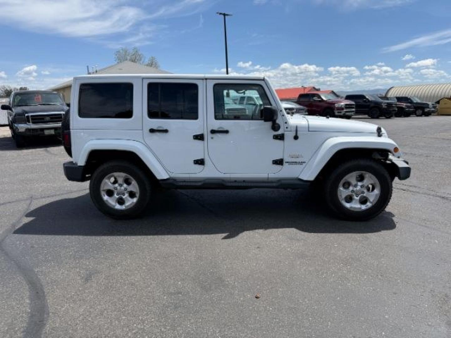 2015 Bright White /Black Jeep Wrangler Unlimited Sahara (1C4BJWEG9FL) with an Pentastar 3.6L V-6 DOHC engine, AUTOMATIC transmission, located at 1235 N Woodruff Ave., Idaho Falls, 83401, (208) 523-1053, 43.507172, -112.000488 - At Timberline Auto, finding a great deal on your next vehicle is always easy! Our experienced sales staff's goal is to help find you the right vehicle at the right price! Our knowledgeable finance department has options for almost any credit score. We offer extended service contract options to prote - Photo#32