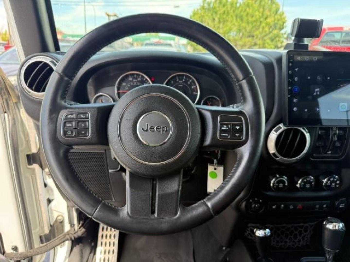 2015 Bright White /Black Jeep Wrangler Unlimited Sahara (1C4BJWEG9FL) with an Pentastar 3.6L V-6 DOHC engine, AUTOMATIC transmission, located at 1235 N Woodruff Ave., Idaho Falls, 83401, (208) 523-1053, 43.507172, -112.000488 - At Timberline Auto, finding a great deal on your next vehicle is always easy! Our experienced sales staff's goal is to help find you the right vehicle at the right price! Our knowledgeable finance department has options for almost any credit score. We offer extended service contract options to prote - Photo#39
