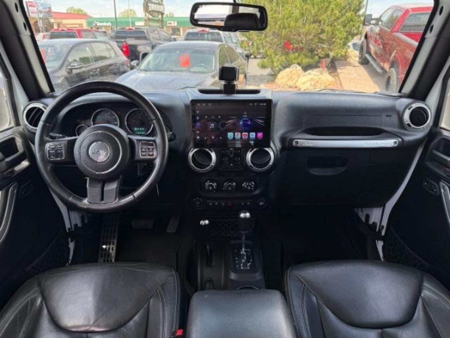 2015 Bright White /Black Jeep Wrangler Unlimited Sahara (1C4BJWEG9FL) with an Pentastar 3.6L V-6 DOHC engine, AUTOMATIC transmission, located at 1235 N Woodruff Ave., Idaho Falls, 83401, (208) 523-1053, 43.507172, -112.000488 - At Timberline Auto, finding a great deal on your next vehicle is always easy! Our experienced sales staff's goal is to help find you the right vehicle at the right price! Our knowledgeable finance department has options for almost any credit score. We offer extended service contract options to prote - Photo#47