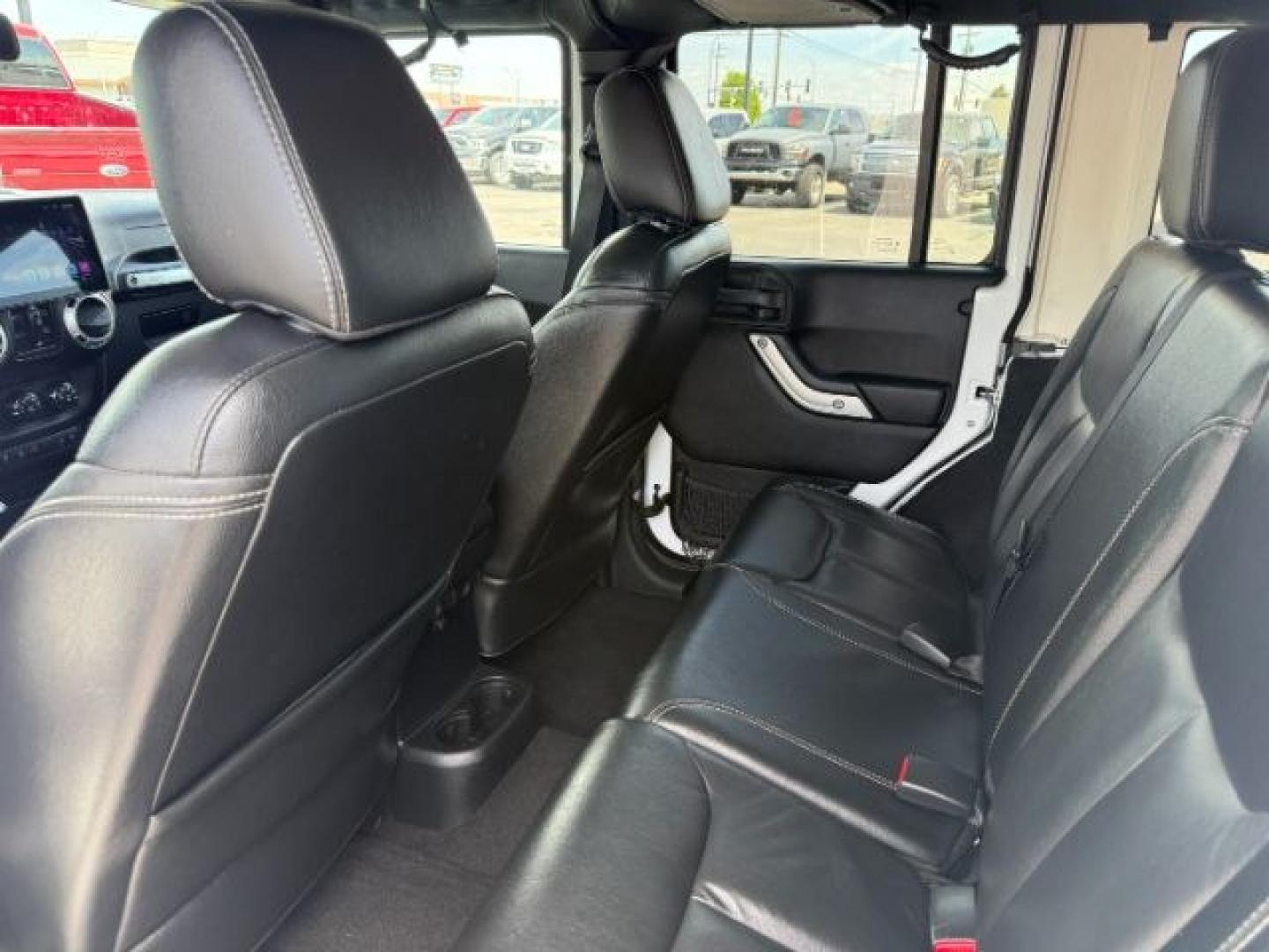 2015 Bright White /Black Jeep Wrangler Unlimited Sahara (1C4BJWEG9FL) with an Pentastar 3.6L V-6 DOHC engine, AUTOMATIC transmission, located at 1235 N Woodruff Ave., Idaho Falls, 83401, (208) 523-1053, 43.507172, -112.000488 - At Timberline Auto, finding a great deal on your next vehicle is always easy! Our experienced sales staff's goal is to help find you the right vehicle at the right price! Our knowledgeable finance department has options for almost any credit score. We offer extended service contract options to prote - Photo#48