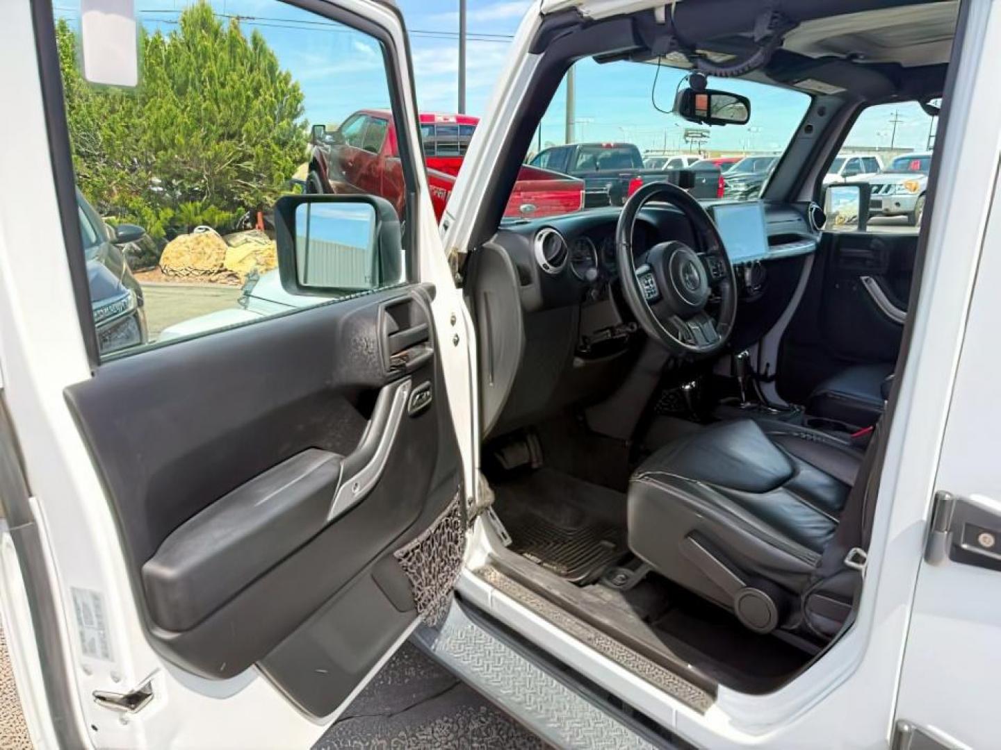 2015 Bright White /Black Jeep Wrangler Unlimited Sahara (1C4BJWEG9FL) with an Pentastar 3.6L V-6 DOHC engine, AUTOMATIC transmission, located at 1235 N Woodruff Ave., Idaho Falls, 83401, (208) 523-1053, 43.507172, -112.000488 - At Timberline Auto, finding a great deal on your next vehicle is always easy! Our experienced sales staff's goal is to help find you the right vehicle at the right price! Our knowledgeable finance department has options for almost any credit score. We offer extended service contract options to prote - Photo#11