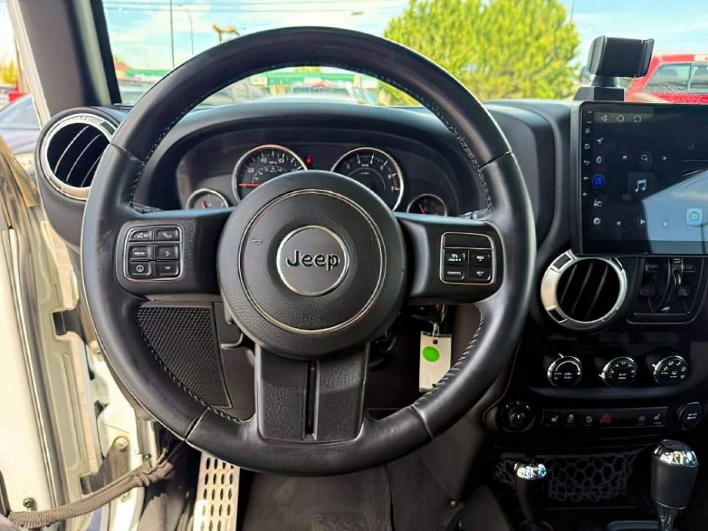 2015 Bright White /Black Jeep Wrangler Unlimited Sahara (1C4BJWEG9FL) with an Pentastar 3.6L V-6 DOHC engine, AUTOMATIC transmission, located at 1235 N Woodruff Ave., Idaho Falls, 83401, (208) 523-1053, 43.507172, -112.000488 - At Timberline Auto, finding a great deal on your next vehicle is always easy! Our experienced sales staff's goal is to help find you the right vehicle at the right price! Our knowledgeable finance department has options for almost any credit score. We offer extended service contract options to prote - Photo#14