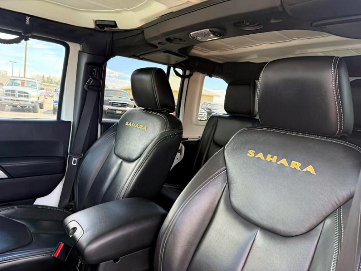 2015 Bright White /Black Jeep Wrangler Unlimited Sahara (1C4BJWEG9FL) with an Pentastar 3.6L V-6 DOHC engine, AUTOMATIC transmission, located at 1235 N Woodruff Ave., Idaho Falls, 83401, (208) 523-1053, 43.507172, -112.000488 - At Timberline Auto, finding a great deal on your next vehicle is always easy! Our experienced sales staff's goal is to help find you the right vehicle at the right price! Our knowledgeable finance department has options for almost any credit score. We offer extended service contract options to prote - Photo#20