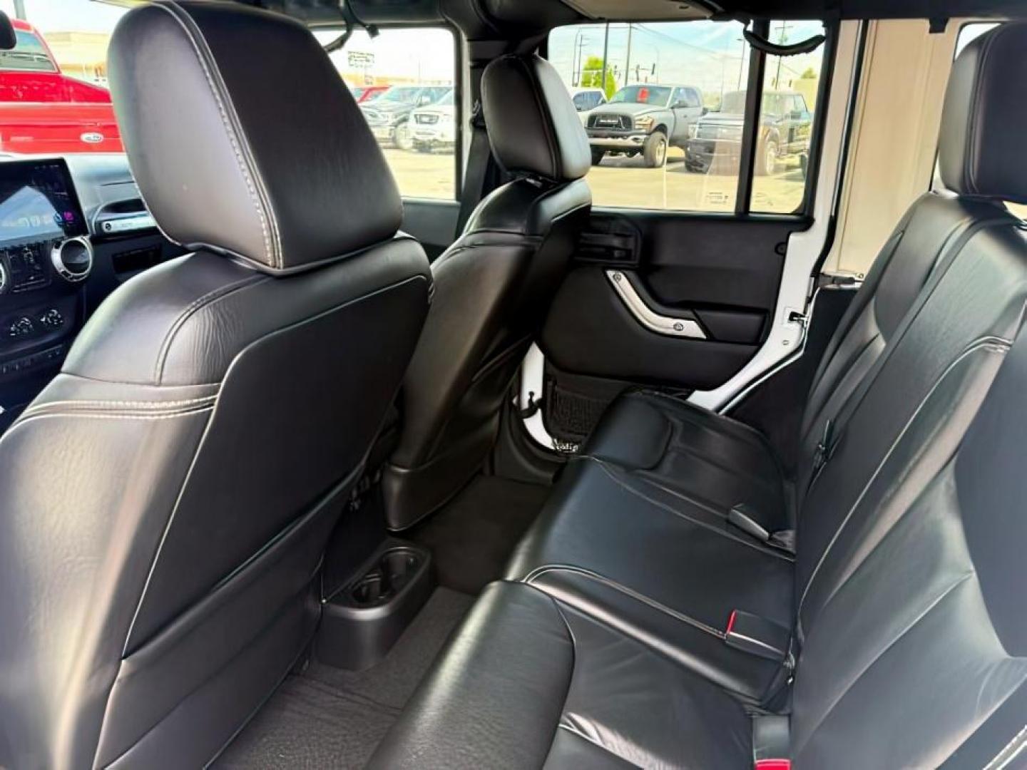 2015 Bright White /Black Jeep Wrangler Unlimited Sahara (1C4BJWEG9FL) with an Pentastar 3.6L V-6 DOHC engine, AUTOMATIC transmission, located at 1235 N Woodruff Ave., Idaho Falls, 83401, (208) 523-1053, 43.507172, -112.000488 - At Timberline Auto, finding a great deal on your next vehicle is always easy! Our experienced sales staff's goal is to help find you the right vehicle at the right price! Our knowledgeable finance department has options for almost any credit score. We offer extended service contract options to prote - Photo#23