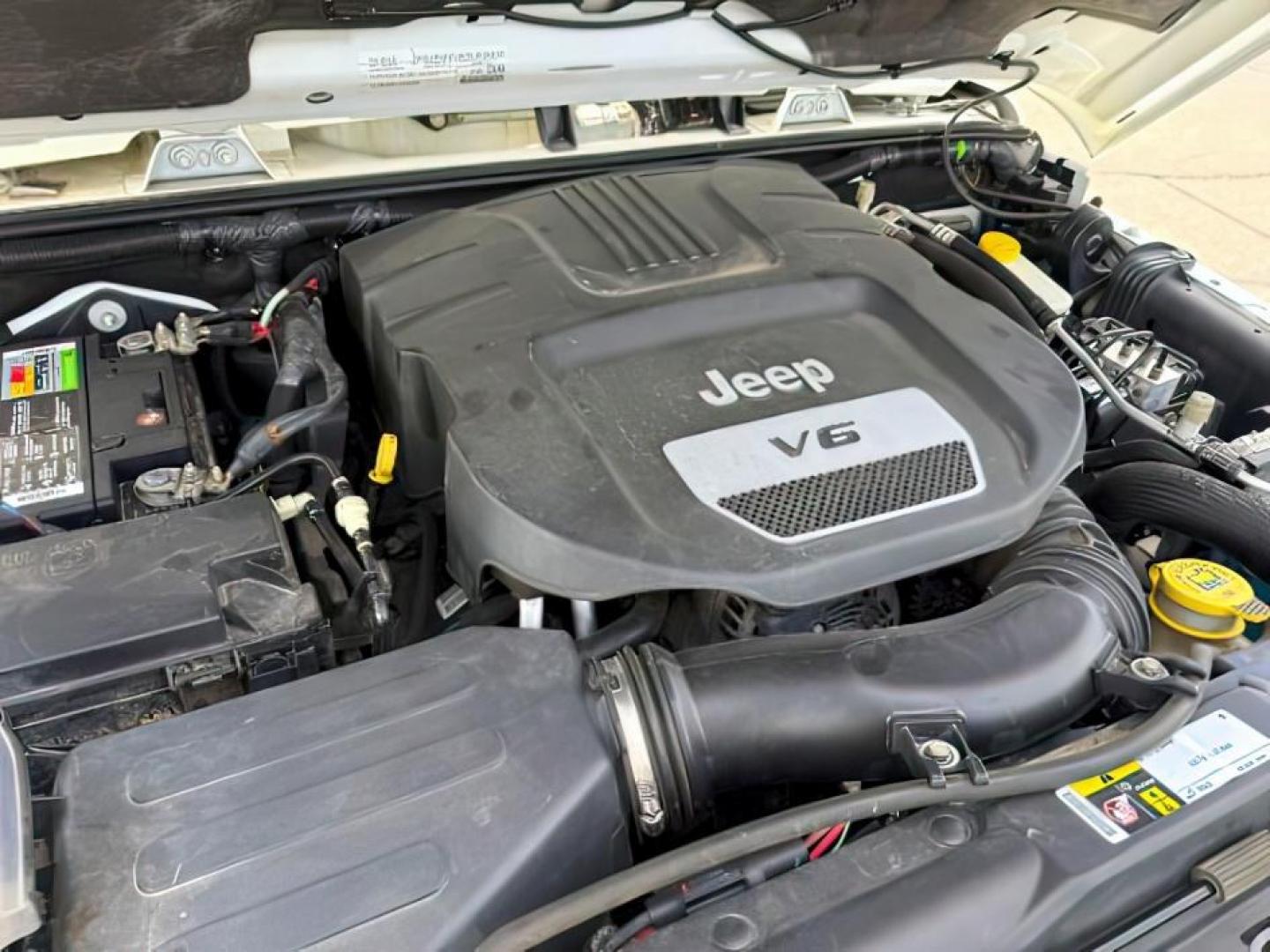 2015 Bright White /Black Jeep Wrangler Unlimited Sahara (1C4BJWEG9FL) with an Pentastar 3.6L V-6 DOHC engine, AUTOMATIC transmission, located at 1235 N Woodruff Ave., Idaho Falls, 83401, (208) 523-1053, 43.507172, -112.000488 - At Timberline Auto, finding a great deal on your next vehicle is always easy! Our experienced sales staff's goal is to help find you the right vehicle at the right price! Our knowledgeable finance department has options for almost any credit score. We offer extended service contract options to prote - Photo#24