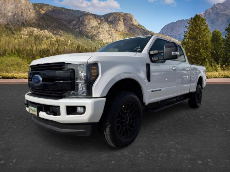 2019 WHITE /Black Ford F-250 LARIAT (1FT7W2BT2KE) with an Powerstroke 6.7L V-8 diesel direct injection engine, AUTOMATIC transmission, located at 1235 N Woodruff Ave., Idaho Falls, 83401, (208) 523-1053, 43.507172, -112.000488 - Clean, confident, and built with purpose, this 2019 Ford F-250 Super Duty brings serious diesel strength with its 6.7L Power Stroke under the hood, ready for demanding towing and heavy hauling. The bed cover adds secure, weather-protected storage that keeps gear and tools locked down and organized,- Photo#0