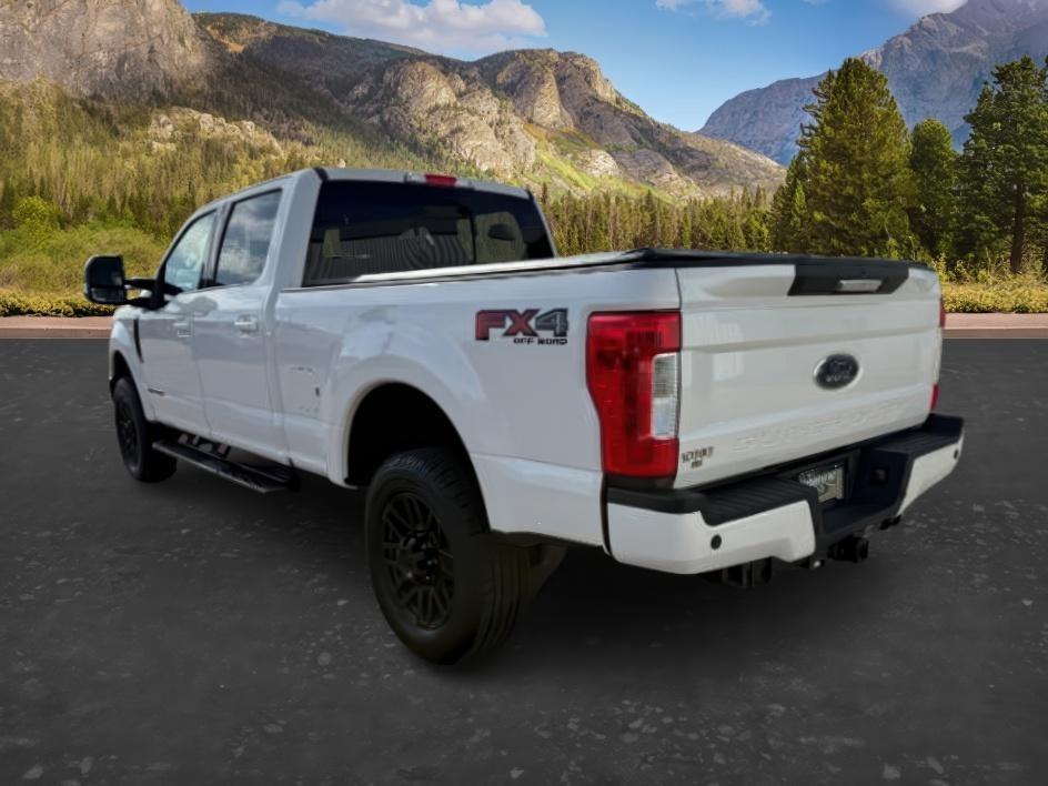 2019 WHITE /Black Ford F-250 LARIAT (1FT7W2BT2KE) with an Powerstroke 6.7L V-8 diesel direct injection engine, AUTOMATIC transmission, located at 1235 N Woodruff Ave., Idaho Falls, 83401, (208) 523-1053, 43.507172, -112.000488 - Clean, confident, and built with purpose, this 2019 Ford F-250 Super Duty brings serious diesel strength with its 6.7L Power Stroke under the hood, ready for demanding towing and heavy hauling. The bed cover adds secure, weather-protected storage that keeps gear and tools locked down and organized,- Photo#2