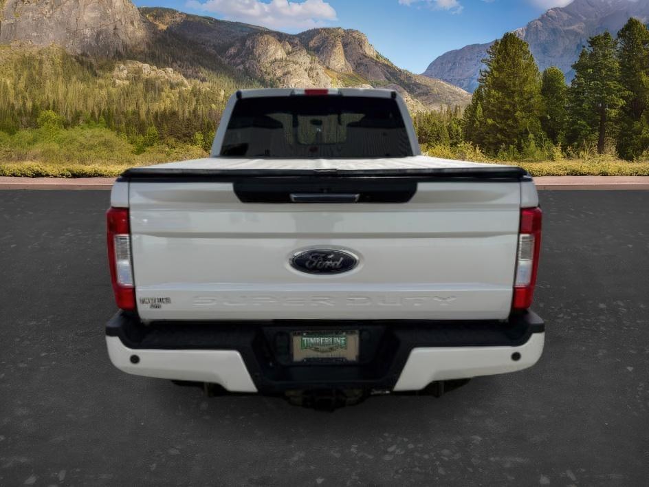 2019 WHITE /Black Ford F-250 LARIAT (1FT7W2BT2KE) with an Powerstroke 6.7L V-8 diesel direct injection engine, AUTOMATIC transmission, located at 1235 N Woodruff Ave., Idaho Falls, 83401, (208) 523-1053, 43.507172, -112.000488 - Clean, confident, and built with purpose, this 2019 Ford F-250 Super Duty brings serious diesel strength with its 6.7L Power Stroke under the hood, ready for demanding towing and heavy hauling. The bed cover adds secure, weather-protected storage that keeps gear and tools locked down and organized,- Photo#3