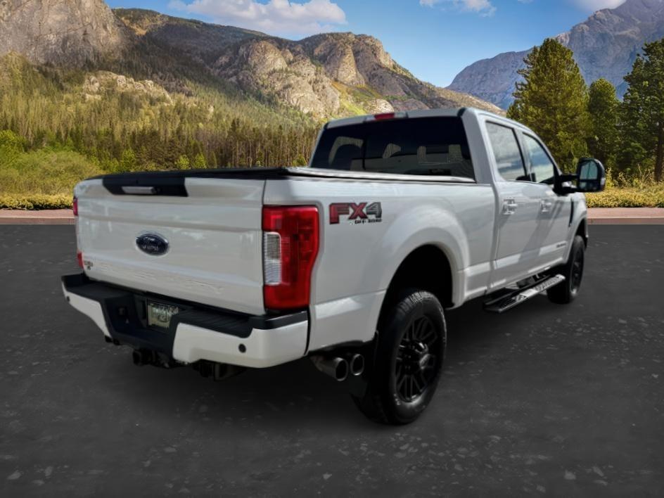 2019 WHITE /Black Ford F-250 LARIAT (1FT7W2BT2KE) with an Powerstroke 6.7L V-8 diesel direct injection engine, AUTOMATIC transmission, located at 1235 N Woodruff Ave., Idaho Falls, 83401, (208) 523-1053, 43.507172, -112.000488 - Clean, confident, and built with purpose, this 2019 Ford F-250 Super Duty brings serious diesel strength with its 6.7L Power Stroke under the hood, ready for demanding towing and heavy hauling. The bed cover adds secure, weather-protected storage that keeps gear and tools locked down and organized,- Photo#6