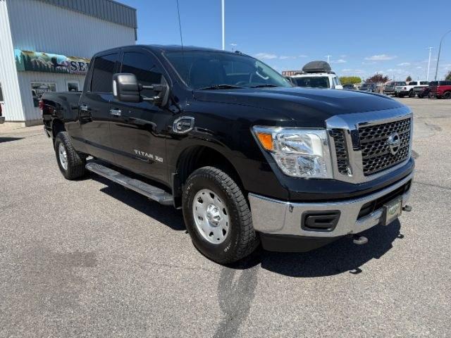 2016 GRAY /Black Nissan TITAN XD SV Diesel (1N6BA1F32GN) with an 5L V-8 diesel direct injection engine, AUTOMATIC transmission, located at 1235 N Woodruff Ave., Idaho Falls, 83401, (208) 523-1053, 43.507172, -112.000488 - Daily truck practicality and heavy duty functionality come together in this 2016 Nissan Titan XD Crew Cab 4x4, combining full size pickup utility with the added strength of the XD platform. Equipped with a 5.0L Cummins turbo diesel V8 and four wheel drive capability, this truck offers diesel power p- Photo#34