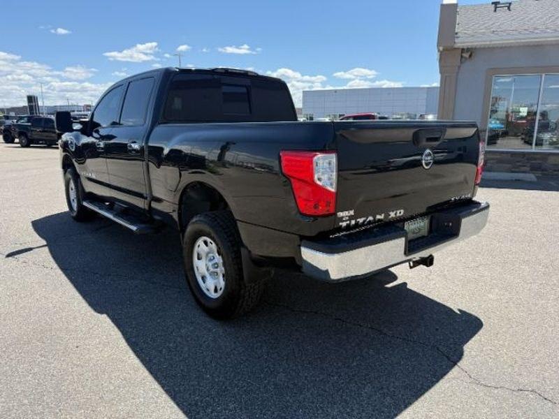 2016 Magnetic Black /Beige Nissan Titan XD SV (1N6BA1F32GN) with an V8, 5.0L engine, 6-speed automatic transmission, located at 1175 N Woodruff Ave, Idaho Falls, ID, 83401, 43.506901, -111.999657 - <b>Vehicle Details</b><br>Looking for a powerful pre-owned truck in Idaho Falls, ID? This 2016 Nissan Titan XD SV Diesel with 4WD delivers the strength, capability, and comfort truck shoppers want. Powered by a V8 5.0L Diesel engine, this Nissan Titan XD is built for towing, hauling, and confident d- Photo#2