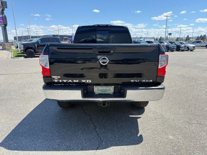 2016 Magnetic Black /Beige Nissan Titan XD SV (1N6BA1F32GN) with an V8, 5.0L engine, 6-speed automatic transmission, located at 1175 N Woodruff Ave, Idaho Falls, ID, 83401, 43.506901, -111.999657 - <b>Vehicle Details</b><br>Looking for a powerful pre-owned truck in Idaho Falls, ID? This 2016 Nissan Titan XD SV Diesel with 4WD delivers the strength, capability, and comfort truck shoppers want. Powered by a V8 5.0L Diesel engine, this Nissan Titan XD is built for towing, hauling, and confident d- Photo#3