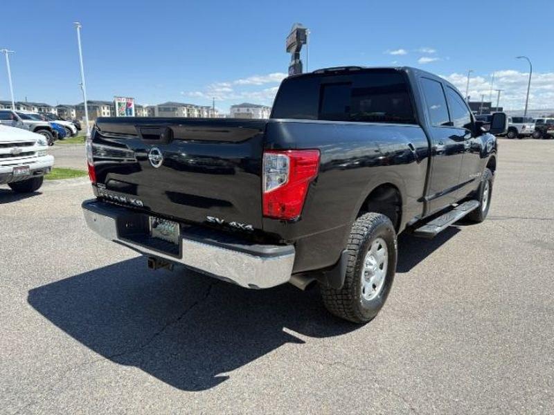 2016 Magnetic Black /Beige Nissan Titan XD SV (1N6BA1F32GN) with an V8, 5.0L engine, 6-speed automatic transmission, located at 1175 N Woodruff Ave, Idaho Falls, ID, 83401, 43.506901, -111.999657 - <b>Vehicle Details</b><br>Looking for a powerful pre-owned truck in Idaho Falls, ID? This 2016 Nissan Titan XD SV Diesel with 4WD delivers the strength, capability, and comfort truck shoppers want. Powered by a V8 5.0L Diesel engine, this Nissan Titan XD is built for towing, hauling, and confident d- Photo#5