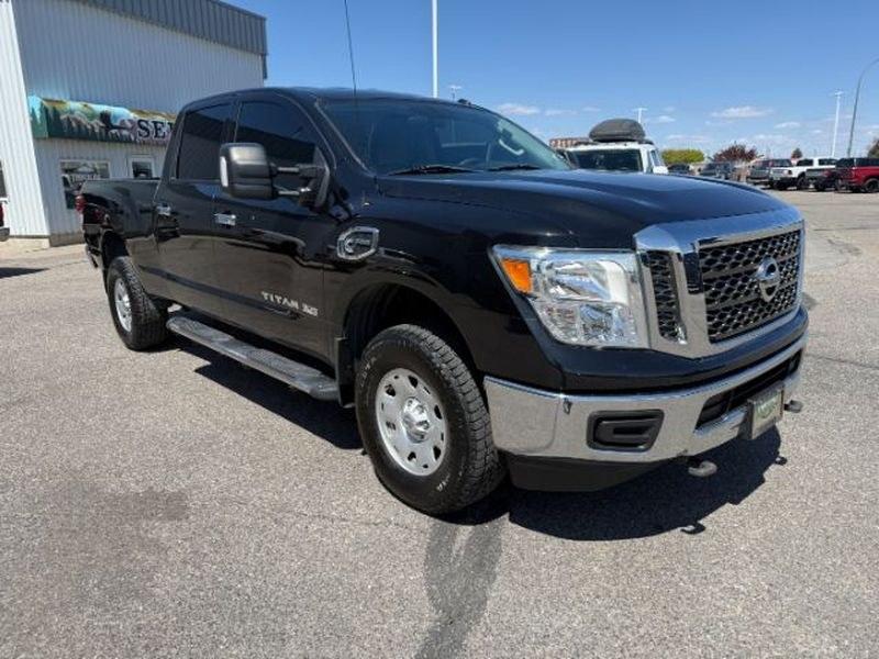 2016 Magnetic Black /Beige Nissan Titan XD SV (1N6BA1F32GN) with an V8, 5.0L engine, 6-speed automatic transmission, located at 1175 N Woodruff Ave, Idaho Falls, ID, 83401, 43.506901, -111.999657 - <b>Vehicle Details</b><br>Looking for a powerful pre-owned truck in Idaho Falls, ID? This 2016 Nissan Titan XD SV Diesel with 4WD delivers the strength, capability, and comfort truck shoppers want. Powered by a V8 5.0L Diesel engine, this Nissan Titan XD is built for towing, hauling, and confident d- Photo#7