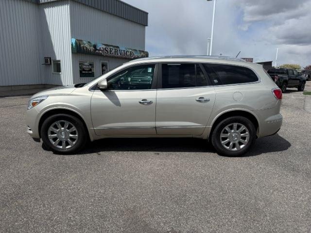2014 GOLD /Ebony Buick Enclave Premium (5GAKVCKD8EJ) with an 3.6L V-6 gasoline direct injection engine, AUTOMATIC transmission, located at 1235 N Woodruff Ave., Idaho Falls, 83401, (208) 523-1053, 43.507172, -112.000488 - This 2014 Buick Enclave is a full-size SUV designed for comfortable family travel with spacious three-row seating and smooth road manners. Powered by a 3.6L V6 (VIN verified), it delivers balanced performance for daily driving, highway trips, and light towing needs. The ride is tuned for comfort, ma- Photo#31