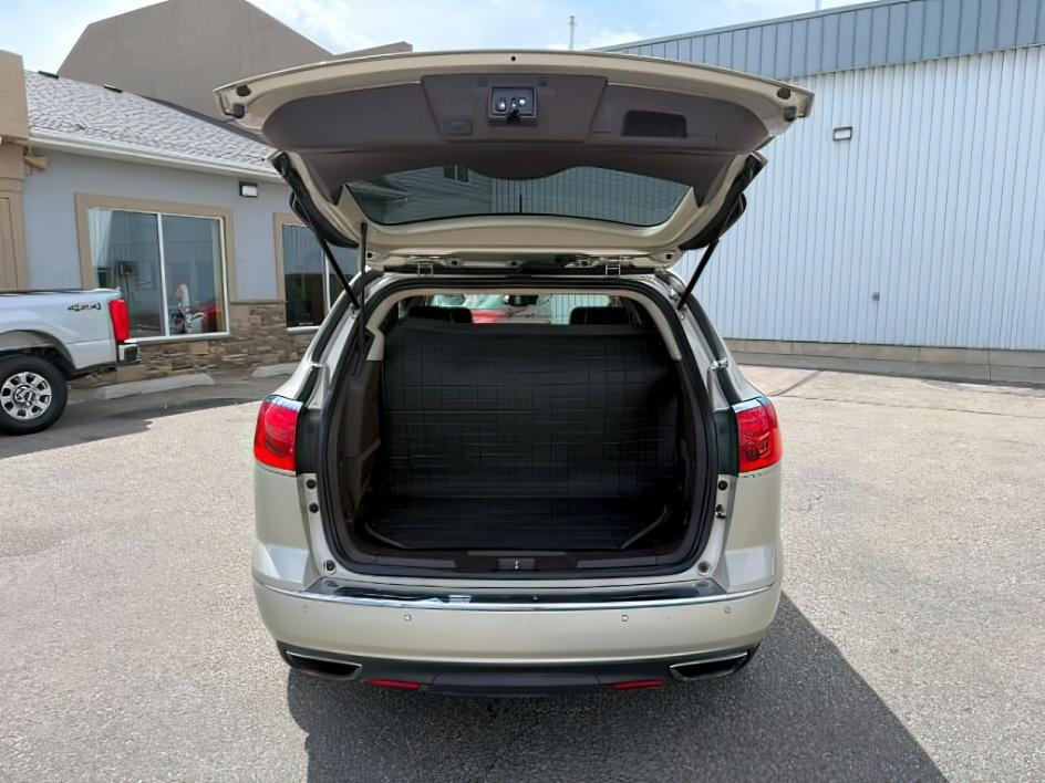 2014 GOLD /Ebony Buick Enclave Premium (5GAKVCKD8EJ) with an 3.6L V-6 gasoline direct injection engine, AUTOMATIC transmission, located at 1235 N Woodruff Ave., Idaho Falls, 83401, (208) 523-1053, 43.507172, -112.000488 - This 2014 Buick Enclave is a full-size SUV designed for comfortable family travel with spacious three-row seating and smooth road manners. Powered by a 3.6L V6 (VIN verified), it delivers balanced performance for daily driving, highway trips, and light towing needs. The ride is tuned for comfort, ma- Photo#5