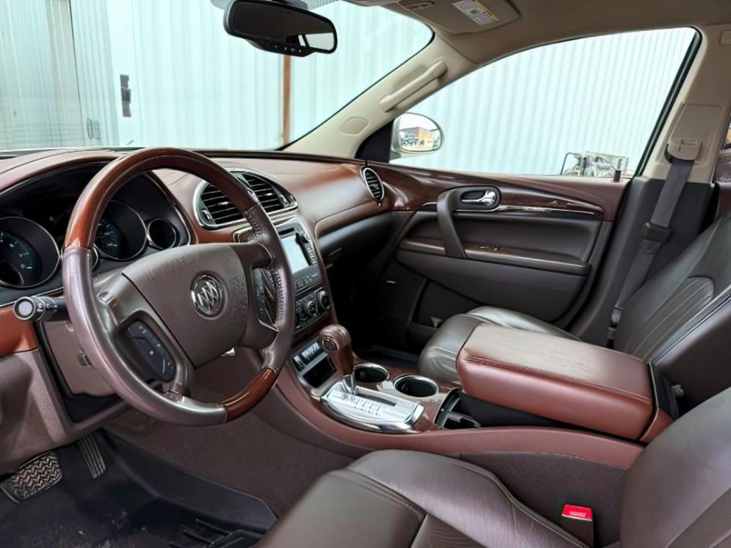 2014 GOLD /Ebony Buick Enclave (5GAKVCKD8EJ) with an 36L V-6 gasoline direct injection engine, Automatic transmission, located at 1175 N Woodruff Ave, Idaho Falls, ID, 83401, 43.506901, -111.999657 - At Timberline Auto, finding a great deal on your next vehicle is always easy! Our experienced sales staff's goal is to help find you the right vehicle at the right price! Our knowledgeable finance department has options for almost any credit score. We offer extended service contract options to prote - Photo#16