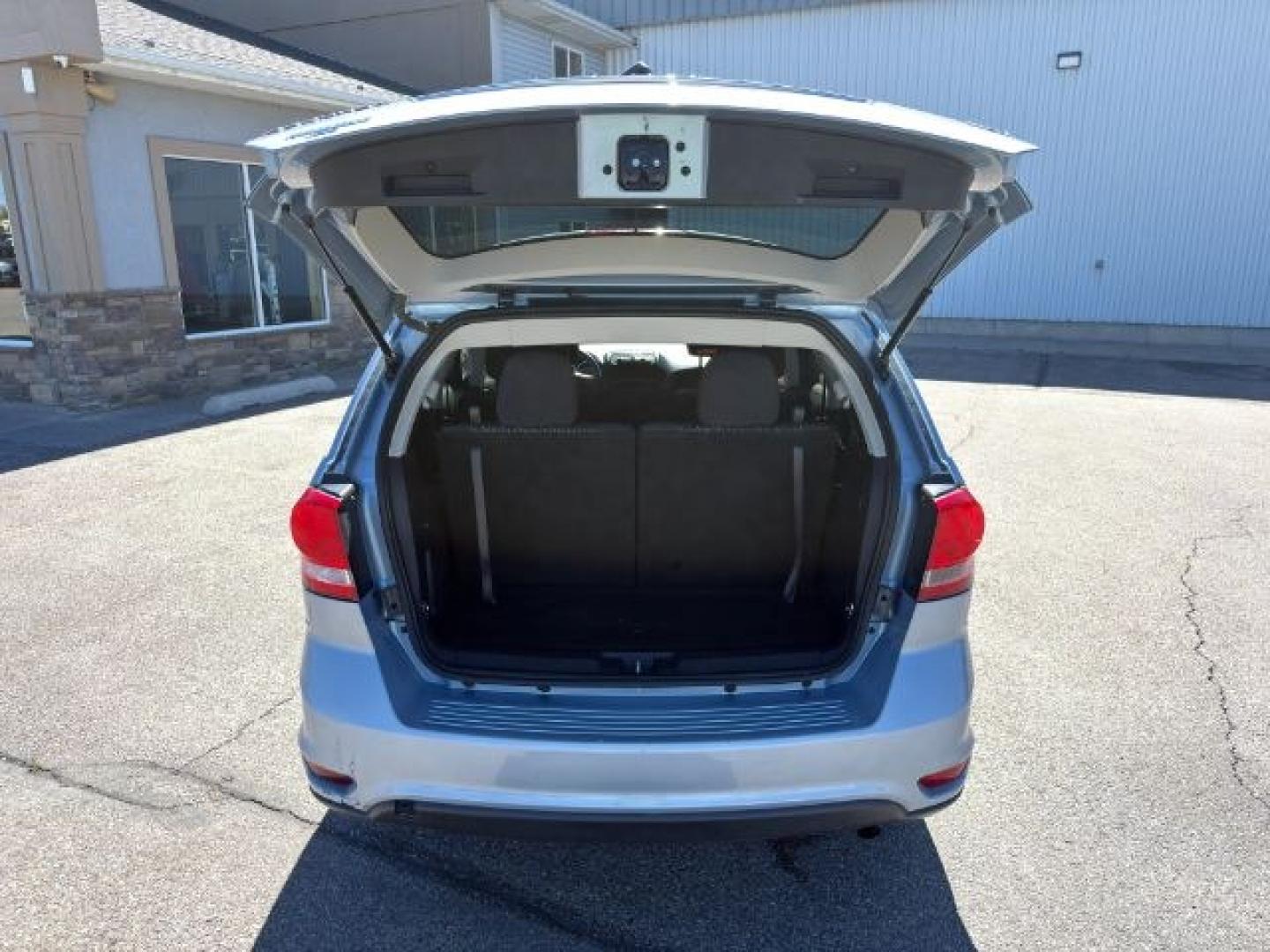 2013 BLUE /Black/Light Frost Dodge Journey (3C4PDCBB4DT) with an 24L I-4 DOHC engine, Automatic transmission, located at 1175 N Woodruff Ave, Idaho Falls, ID, 83401, 43.506901, -111.999657 - This 2013 Dodge Journey is a versatile midsize crossover built to handle the demands of daily driving, family errands, and weekend travel. Powered by a 2.4L I4 engine, it offers practical efficiency and dependable performance for commuting and highway trips. The interior provides comfortable seating- Photo#4