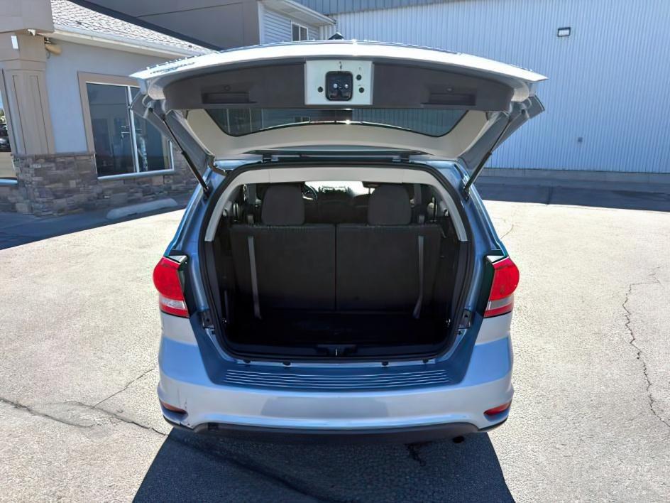 2013 BLUE /Black/Light Frost Dodge Journey (3C4PDCBB4DT) with an 24L I-4 DOHC engine, Automatic transmission, located at 1175 N Woodruff Ave, Idaho Falls, ID, 83401, 43.506901, -111.999657 - This 2013 Dodge Journey is a versatile midsize crossover built to handle the demands of daily driving, family errands, and weekend travel. Powered by a 2.4L I4 engine, it offers practical efficiency and dependable performance for commuting and highway trips. The interior provides comfortable seating - Photo#4