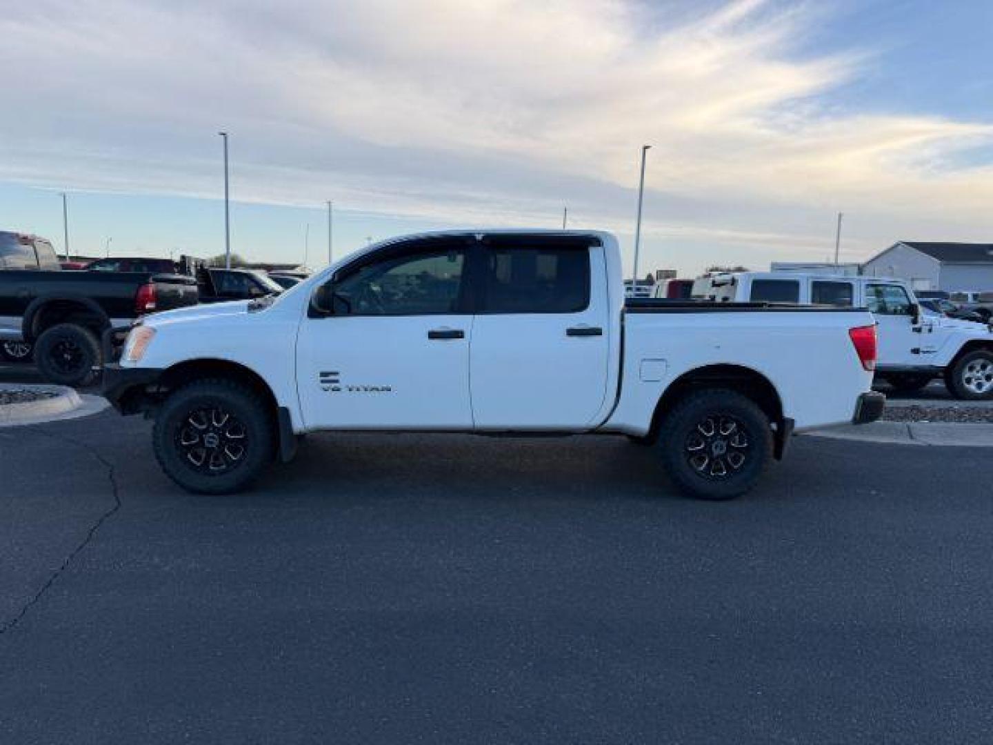 2014 WHITE /CLOTH Nissan Titan (1N6AA0EJ7EN) with an 56L V8 engine, Automatic transmission, located at 1175 N Woodruff Ave, Idaho Falls, ID, 83401, 43.506901, -111.999657 - At Timberline Auto, finding a great deal on your next vehicle is always easy! Our experienced sales staff's goal is to help find you the right vehicle at the right price! Our knowledgeable finance department has options for almost any credit score. We offer extended service contract options to prote - Photo#1