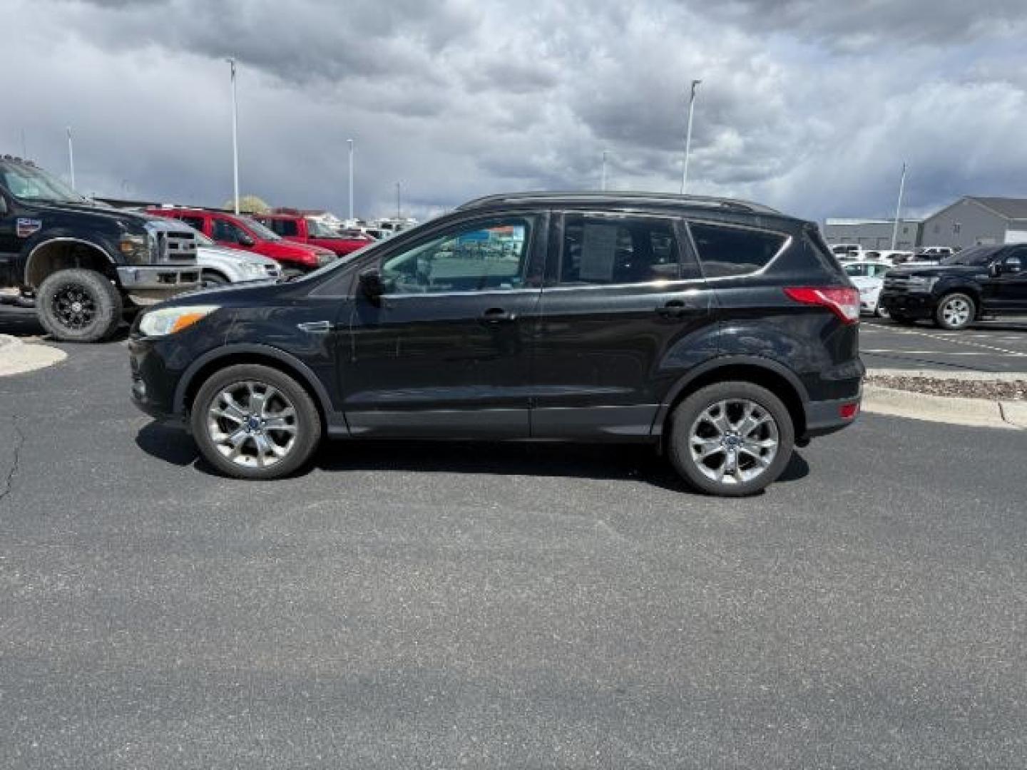 2014 BLACK /CLOTH Ford Escape (1FMCU9GX2EU) with an 16L I4 engine, Automatic transmission, located at 1175 N Woodruff Ave, Idaho Falls, ID, 83401, 43.506901, -111.999657 - At Timberline Auto, finding a great deal on your next vehicle is always easy! Our experienced sales staff goal is to help find you the right vehicle at the right price! Our knowledgeable finance department has options for almost any credit score. We offer extended service contract options to prot - Photo#1