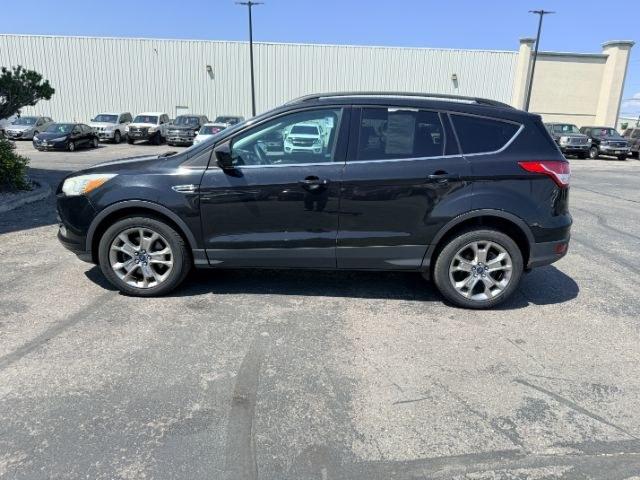 2014 BLACK /CLOTH Ford Escape (1FMCU9GX2EU) with an 16L I4 engine, Automatic transmission, located at 1175 N Woodruff Ave, Idaho Falls, ID, 83401, 43.506901, -111.999657 - Compact SUV practicality and everyday drivability come together in this 2014 Ford Escape 4WD equipped with a 1.6L EcoBoost turbocharged engine. Four wheel drive capability adds traction for changing road conditions while the compact SUV size keeps it easy to maneuver around town and in tighter parki- Photo#29